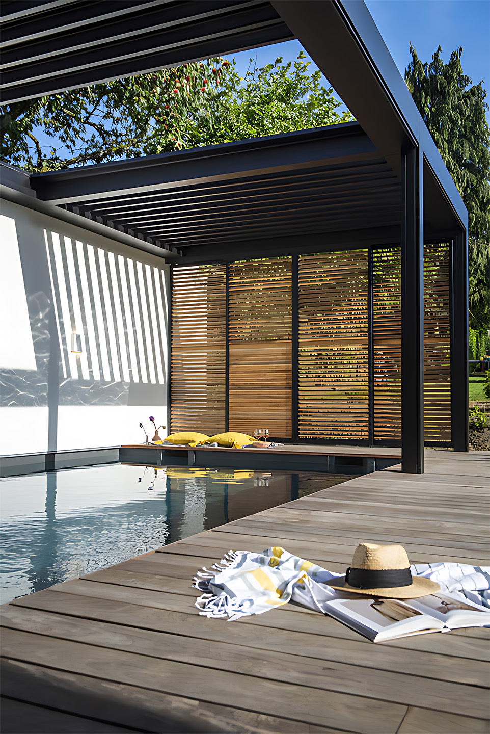Photo of a permanant pergola over a luxurious pool